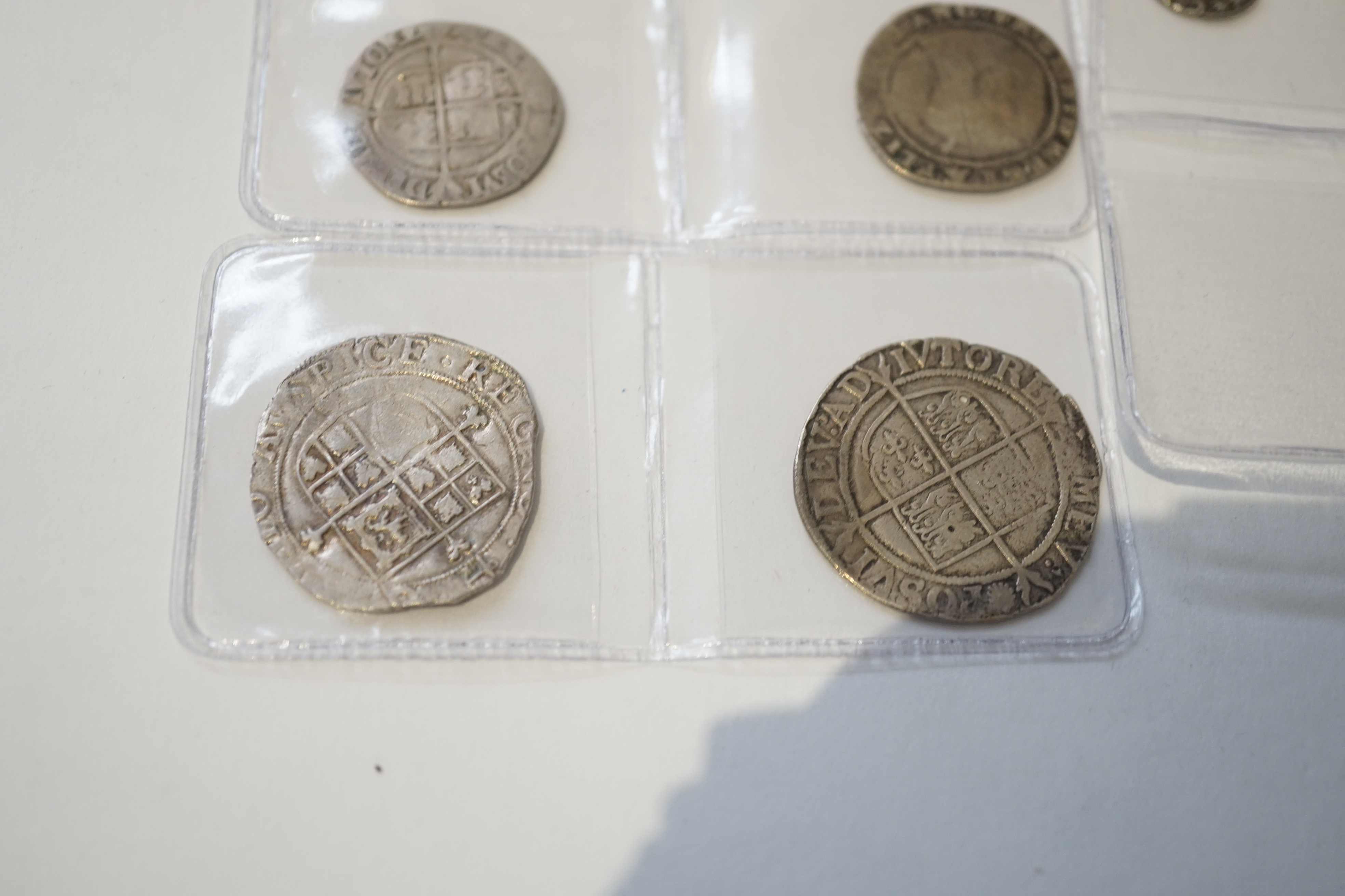 British Tudor and Stuart hammered silver coins, an Elizabeth I shilling and two sixpences, a James I sixpence, two Charles I shillings, a Charles II penny, first issue, 1660-62, (S3311) VF, twopence (S3310) (8)